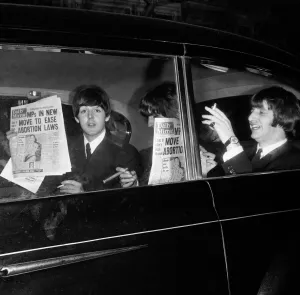 The Beatles leaving The Daily Mirror Golden Ball each with a copy of the paper