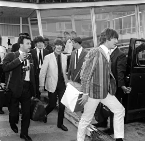 The Beatles at London Airport after returning home from performing in Stockholm, Sweden