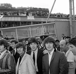 The Beatles at London Airport after returning home from performing in Stockholm