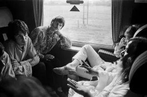 00332 Prints: The Beatles with Marhirishi Yogi aboard a train bound for Bangor in North Wales