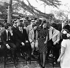 Beatles members front row left to right: George Harrison, John Lennon