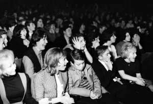 00180 Prints: The Beatles November 1963 Fans of The Beatles cheer as the band play at the Odeon