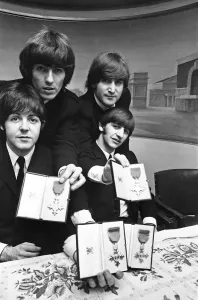 Group Shot Prints: The Beatles show off their MBE medals after the royal investiture at Buckingham Palace