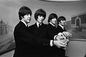 00332 Prints: The Beatles show off their MBE medals after the royal investiture at Buckingham Palace