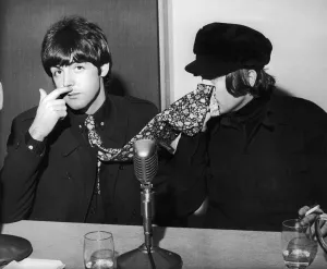 The Beatles Paul McCartney and John Lennon pictured at a backstage news press conference
