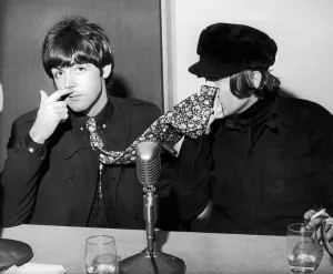 The Beatles Paul McCartney and John Lennon pictured at a backstage news press conference