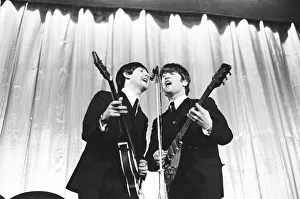 Beatles Paul McCartney and John Lennon seen here performing on stage November 1964 ***