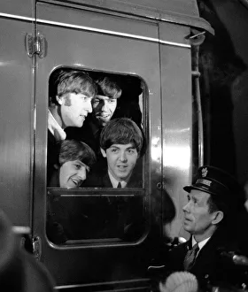Core08 Prints: The Beatles peer from a train carriage window at Paddington Station, London