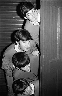 Suits Prints: The Beatles peering out from behind a door. before the groups appearence at Sunday Night