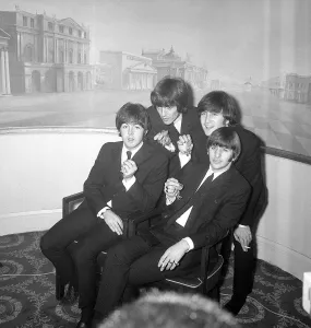 The Beatles pose with their MBEs at a press conference held at the Saville Theatre