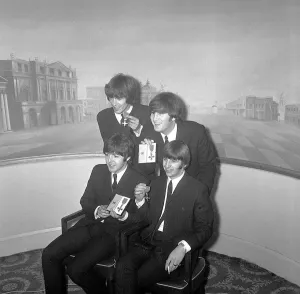 The Beatles pose with their MBEs at a press conference held at the Saville Theatre