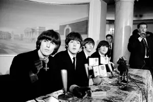 The Beatles pose with their MBEs at a press conference held at the Saville Theatre