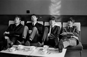 The Beatles relax during rehearsals at The Prince of Wales Theatre in London for