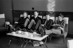 The Beatles relax during rehearsals at The Prince of Wales Theatre in London for