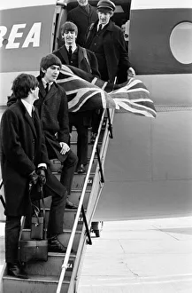 The Beatles return from Paris on BEA flight, landing at London Heathrow Airport