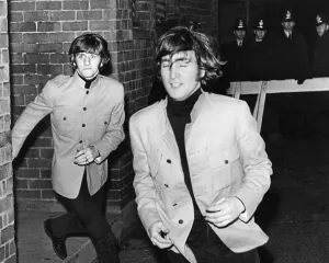 The Beatles, Ringo Starr and John Lennon dash from the fans at the Birmingham Odeon