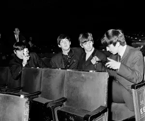 The Beatles at the Ritz Cinema in Belfast. John Lennon taking pictures in Belfast