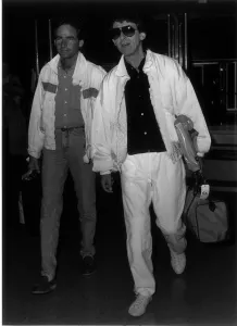 Former Beatles singer and guitarist George Harrison with Barry Sheene at London Airport