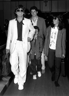 Former Beatles singer and guitarist George Harrison and family with a child of a friend