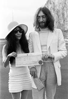 British Overseas Terrirory Prints: Beatles singer John Lennon and his new bride Yoko Ono holding their marriage certificate
