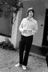 Beatles singer Paul McCartney relaxing in the grounds of his father