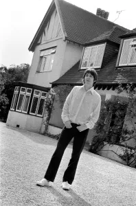 Beatles singer Paul McCartney relaxing in the grounds of his father