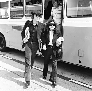 Time Prints: Former Beatles singer and songwriter John Lennon and wife Yoko Ono holding hands as they