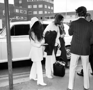 Beatles singer songwriter John Lennon and wife Yoko Ono pictured at Heathrow today