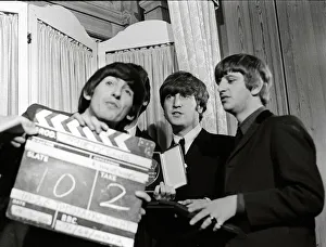 00084 Prints: The Beatles with Variety Club Award March1964 Fooling around with a clapperboard