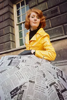 00047 Prints: Beautician Kay Orr seen here modelling a bright yellow raincoat