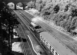 00040 Prints: A beautiful summers day as an express gallops along the Southern Region four-track