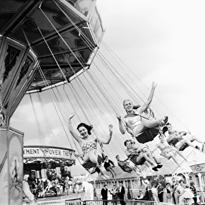 Fairground Rides Prints: Beauty contest girls at Clacton Butlins on a fairground ride