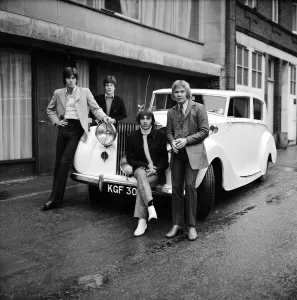 White Prints: The Bee Gees examine an early christmas present from agent Robert Stigwood