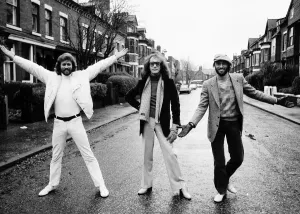 The Bee Gees pop group 1981 Barry Gibb Maurice Gibb Robin Gibb standing in street