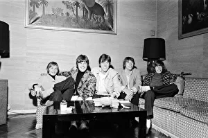 00116 Prints: The Bee Gees seen here watching television in their hotel room 17th October 1967