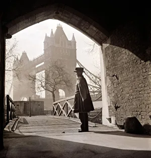 Guard Prints: A beefeater guards the entrance to the Tower of London circa 1950s