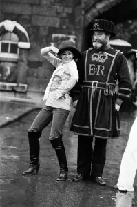 00967 Prints: Beefeater Rory Crozier looks on with disbelief as disco dancer Lucia Catti (18