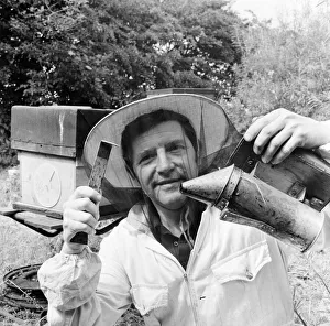 Equipment Prints: Beekeeper, G Baitey, holding Smoker with heat shield and hook, Newcastle, 22nd July 1971