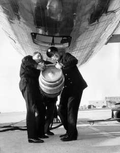 Barrel Prints: A beer barrel is loaded into the cargo hold of a De Havilland Comet at London Airport