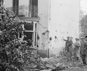 Belgian Army officers inspect the latest bomb damage in Antwerp the result of one of