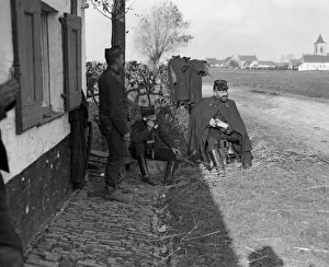 00119 Prints: Belgian artillery officer seen here receiving a report on the fall of his shots