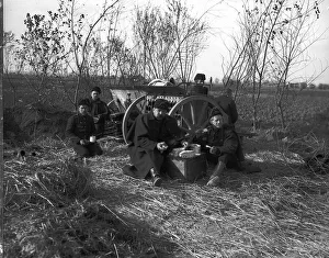 Meals Prints: Belgian artillerymen having a meal by their gun during World War One Circa 1915