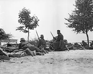 Belgian riflemen lying on the road facing the German advance at Louvain