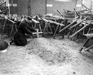 Belgian Prints: This Belgian soldier was given the job of making wooden crosses to mark the graves of his