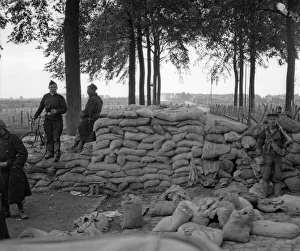 Binoculars Prints: Belgian soldiers and Royal Marines from the Naval Brigade seen here manning a barricade