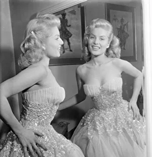01202 Prints: Belinda Lee, British actress tries on dress designed by Julie Harris
