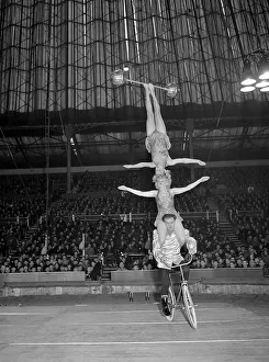 Bertram Mills Circus Acts Dec 1952 Two woman ballance on the shoulders of man