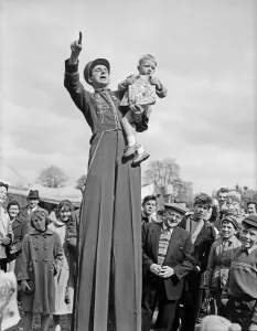 The Bertram Mills Circus comes to town as one worried little boy looks down from the arms