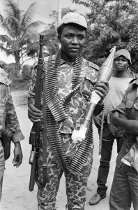African Prints: A Biafran soldier seen here holding an AK-47 assault rifle in one hand