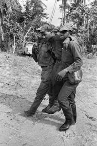African Prints: Biafran soldiers seen here carrying an injured comrade during the Biafra conflict